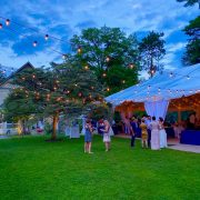 Bistro Lights outside White Structure Tent