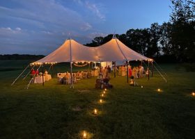 32X51 SAILCLOTH TENT WITH SWAGGED BISTRO LIGHTS IN THE EVENING #3