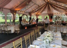 White Top Tent with Vanilla Swagging and Golden Glass Hanging Lanterns
